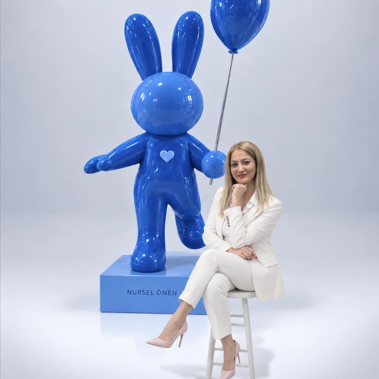 Nursel Önen next to one of her sculptures